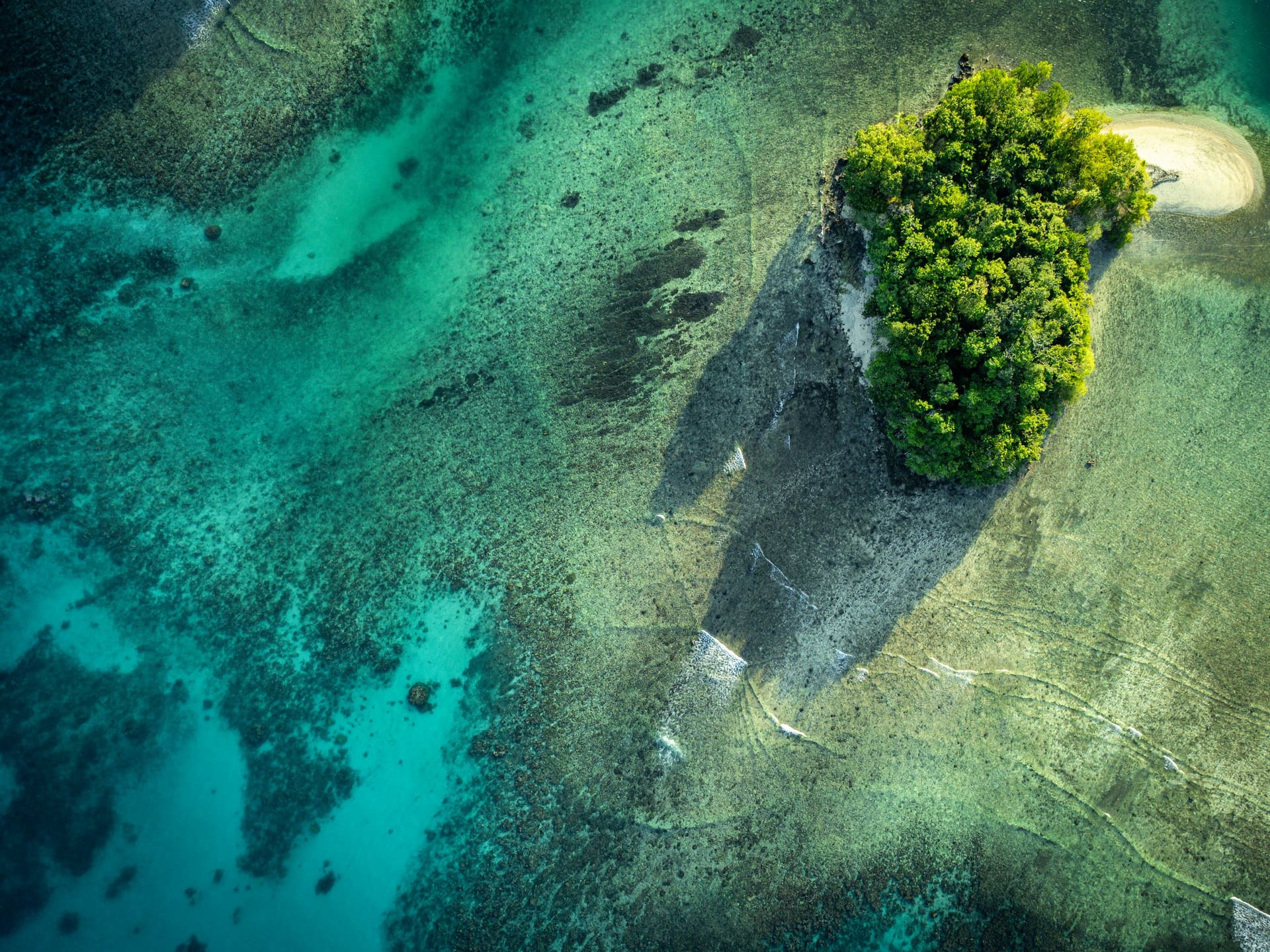 Aerial view of a calm turquoise lagoon